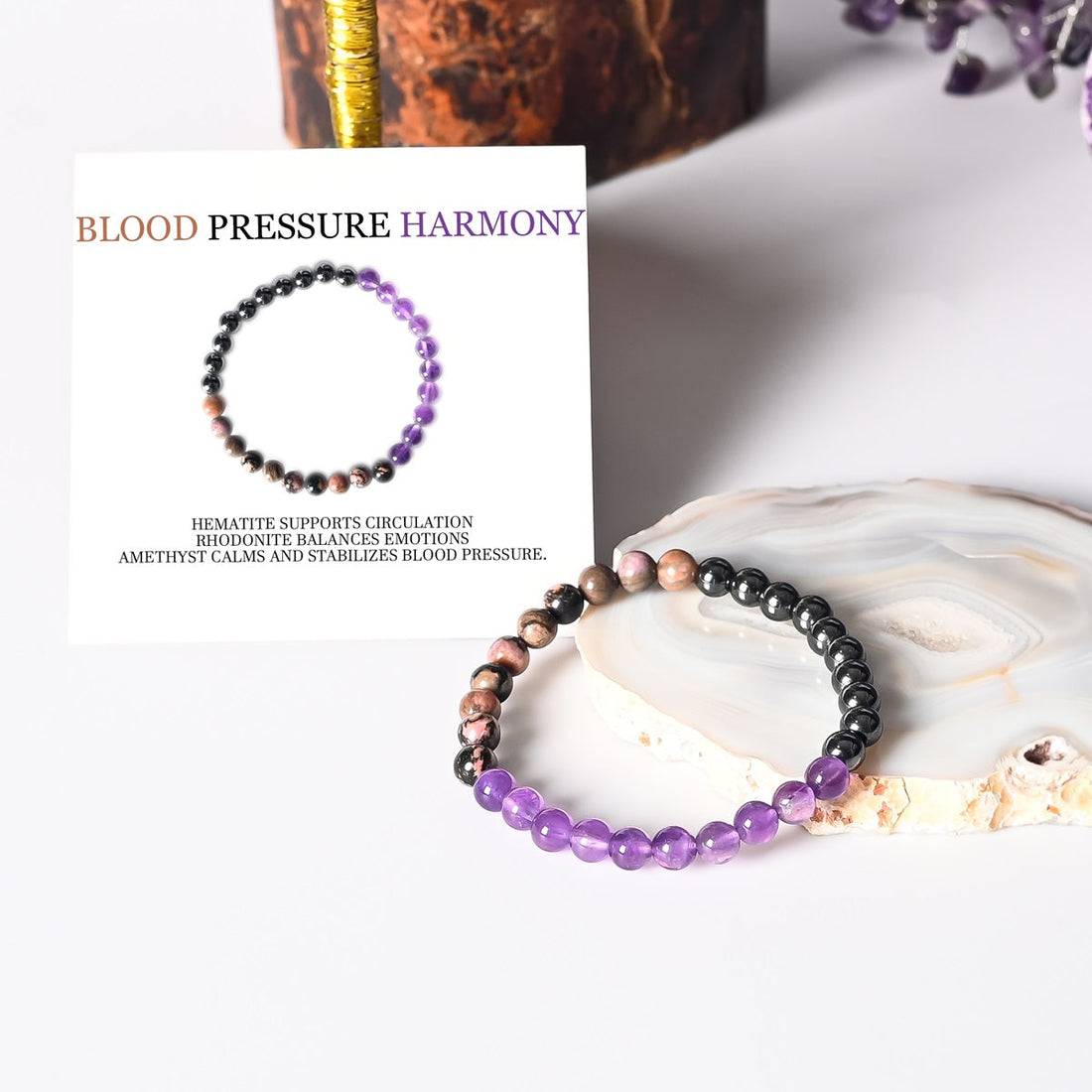 An ensemble shot featuring the exquisite Blood Pressure Harmony Bracelet, adorned with Hematite, Rhodonite, and Amethyst gemstone beads