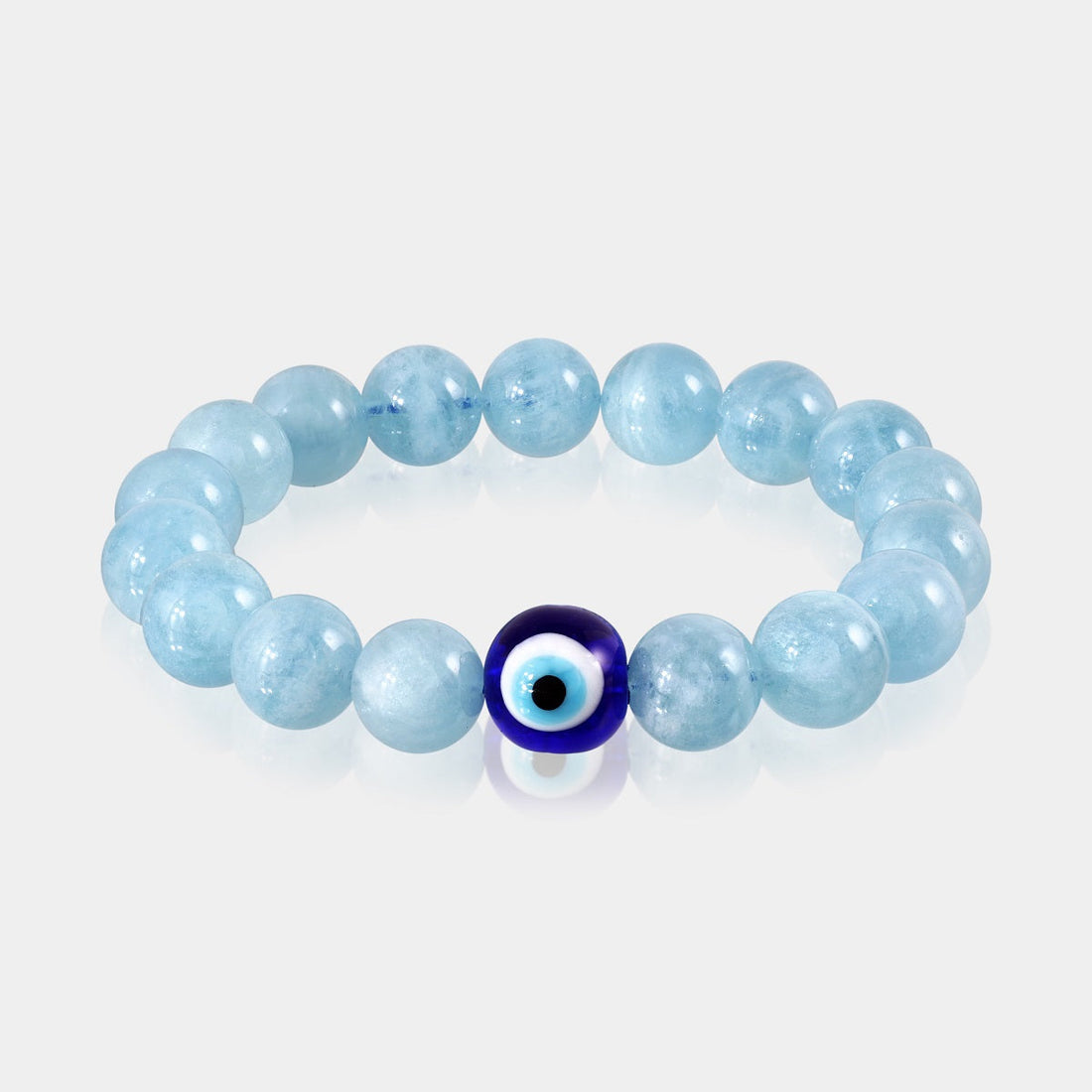 Close-up of smooth round Aquamarine gemstone beads in a soothing blue color.