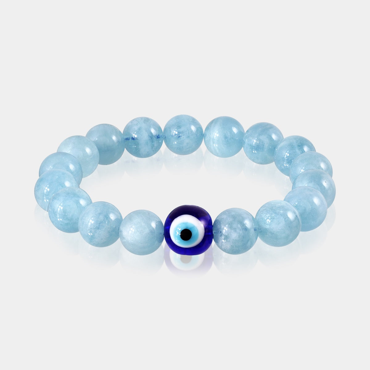 Close-up of smooth round Aquamarine gemstone beads in a soothing blue color.