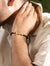 Black leather braided horseshoe bracelet